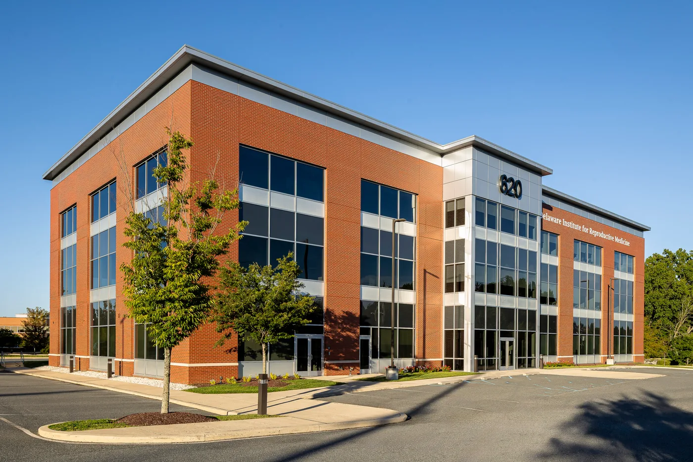 Corner of the medical office building under a deep blue sky