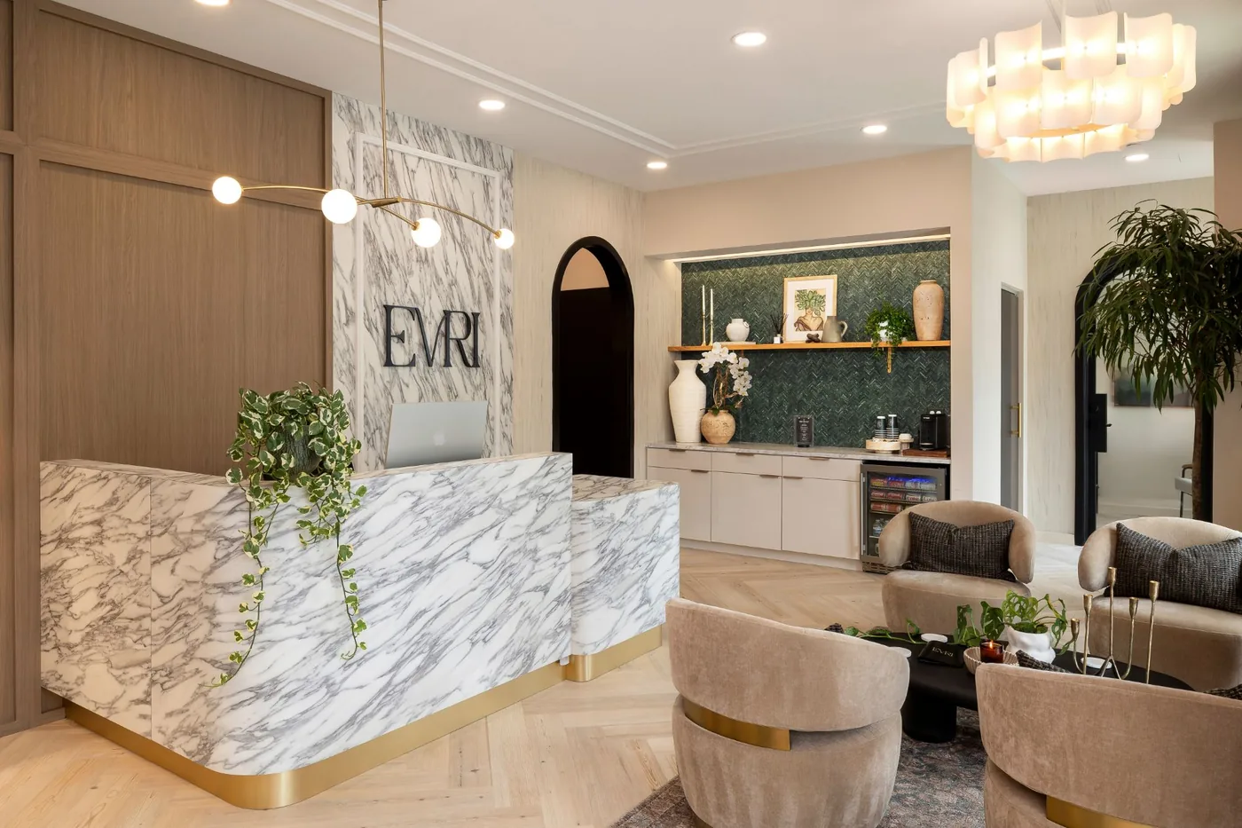 Reception lounge with coffee bar beneath arched openings