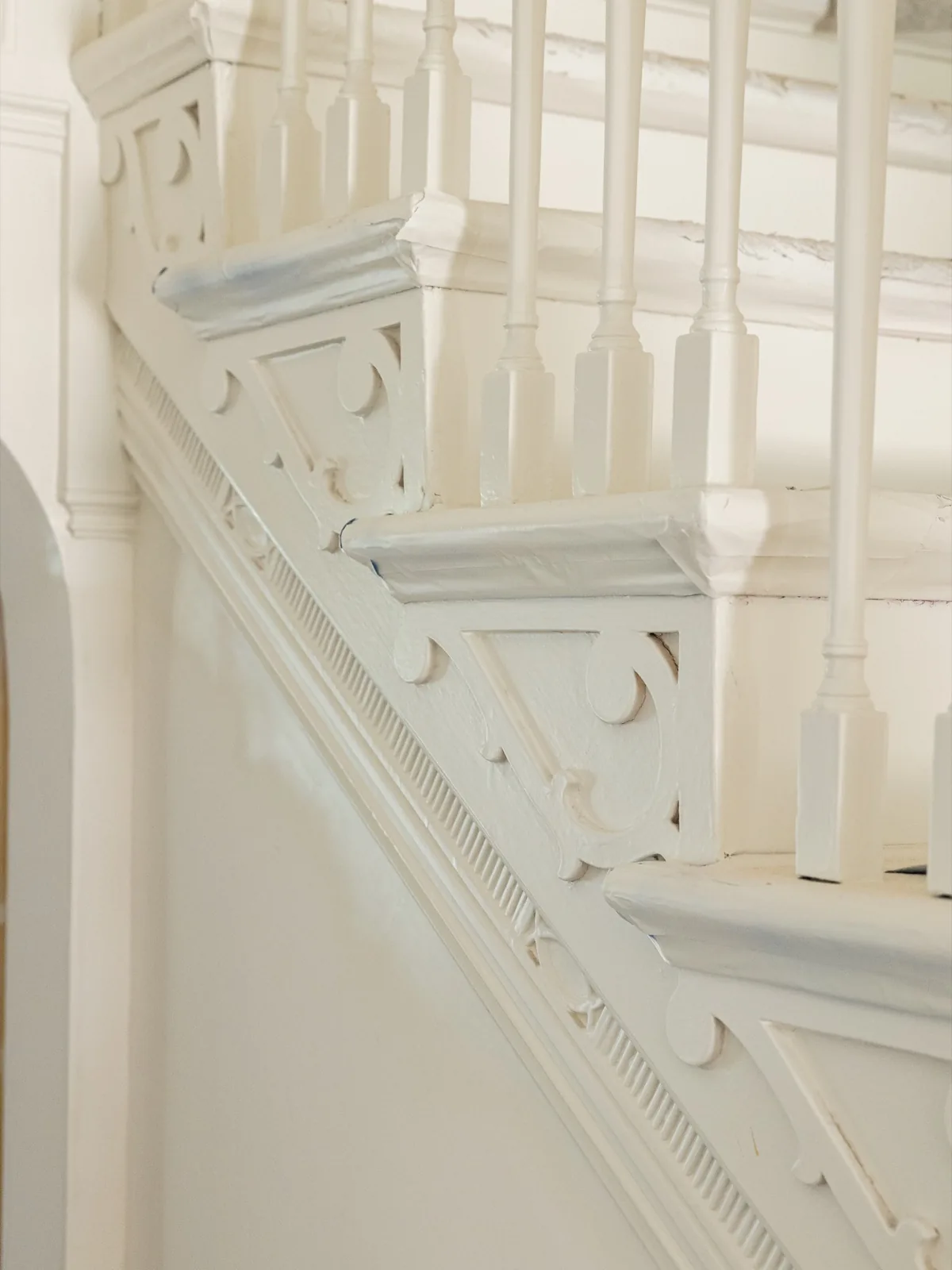 Carved stair bracket and balusters, detail