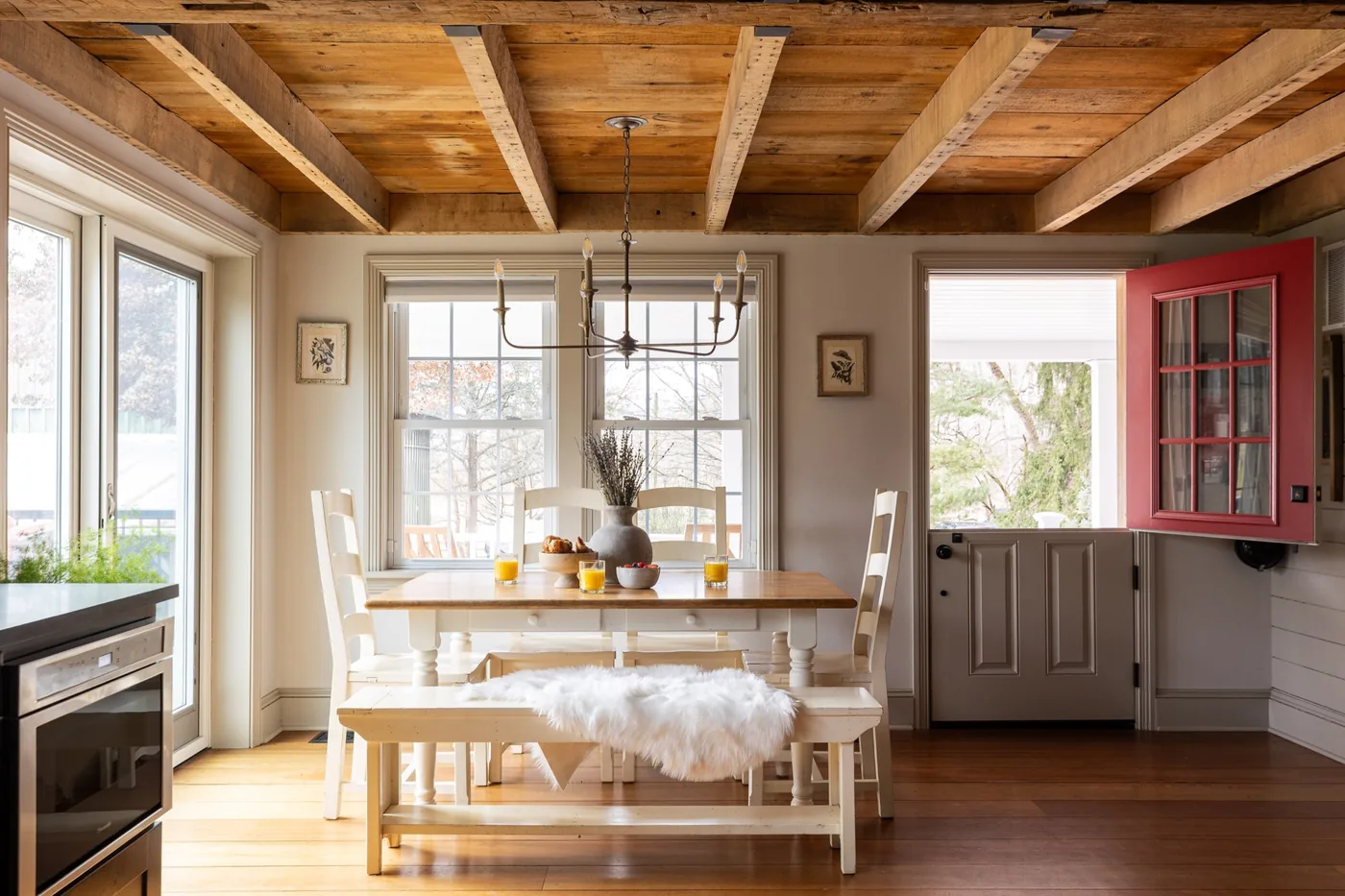 Farmhouse dining room under a reclaimed timber ceiling